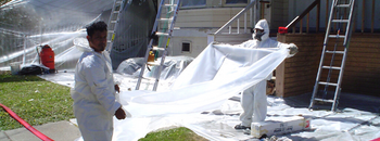 people laying down protective sheeting