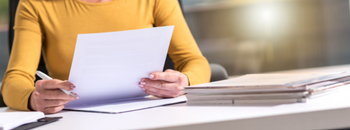 person reading a paper